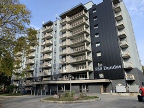 A woman was arrested after a man was stabbed Tuesday morning at an apartment building at 580 Dundas St.