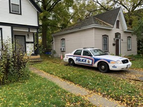 London police officers patrol Stanley Street amid reports of an armed person Monday morning. (DEREK RUTTAN, The London Free Press)