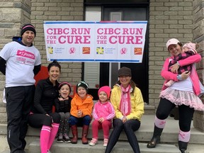 The CIBC Run for the Cure scattered throughout London for this year. Volunteer community run director Meghan Geddis gathered her friends and family together on her porch before their run. They are Brian Citibank, Fiona Geddis, Ainsleigh Legg, Ryler Hummel, Addison Legg, Karen Hummel and Meghan Geddis, holding daughter Madison Costigan. (JANE SIMS, The London Free Press)