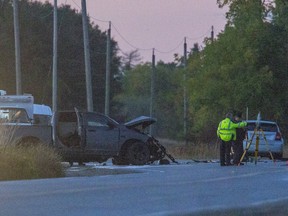 Police investigate a fatal collision Friday between a pickup truck and another vehicle at Highbury Avenue South and Glanworth Drive in London. Police say a St. Thomas driver was killed and another from that city is charged. (Derek Ruttan/The London Free Press)