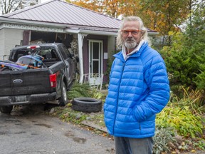 Hubert Van Niekerk stands in front of his rental property at 30 Elliot St. in London on Monday October 19, 2020. Nobody was inside the east-end house when it was struck by a stolen pickup truck Monday morning, police say.