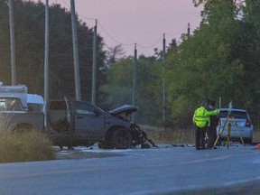 Police investigate a fatal collision Friday between a pickup truck and another vehicle at Highbury Avenue South and Glanworth Drive in London. Police say a St. Thomas driver was killed and another from that city is charged. Derek Ruttan/The London Free Press/Postmedia Network