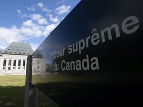 Clouds pass by the Supreme Court of Canada in Ottawa, Friday June 12, 2020.