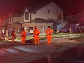 Fire crews responded early Tuesday to fire in the city's northwest end caused after a vehicle crashed into a home. (Photo by London Fire Department)