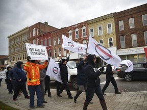 About 75 people protested public health measures, so called 'anti-lockdown protesters' in Woodstock's downtown on Sunday. (Kathleen Saylors/Woodstock Sentinel-Review)