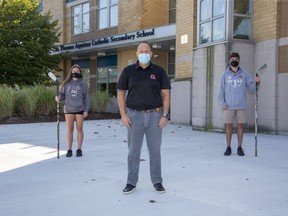 Madison Chantler, a player on the STA girls hockey team, Chad Palmer, coach of the STA boys hockey team and Dylan Dundas, a player on the STA boys hockey team in London, Ont. on Tuesday September 22, 2020. Derek Ruttan/The London Free Press/Postmedia Network