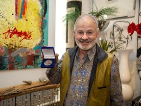 James Telfer holds a medal he designed for people who have lived with diabetes for 50 years. The London artist was diagnosed with Type 1 diabetes when he was 12 and he will receive the medal himself from St. Joseph’s Health Care on Saturday. (Derek Ruttan/The London Free Press)