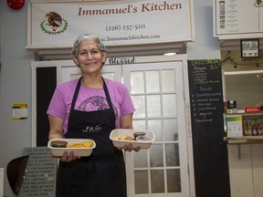 Immanuel's Kitchen owner Ester Garcia offers keto-friendly Latin foods in her new business at Somerville 630, including a Colombian empanada in her right hand and a Salvadoran pupusa in her left. It's another sign of innovation on the London food front. (Derek Ruttan/The London Free Press)