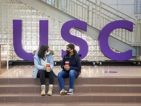 First-year Western University students Sogol Noormandi (left) and Maha Khawaja enjoy coffee in the University Community Centre, home of the University Student Council (USC) in London in this November 2020 photo. (Derek Ruttan/The London Free Press)