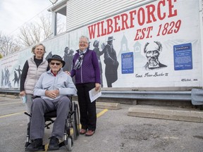 Ed Butler, his wife Annelies, left, and his niece Marlene Thornton attend the official unveiling of a mural in Lucan on Friday commemorating the former Wilberforce Colony of escaped Black slaves who made their way north on the Underground Railroad. Butler and Thornton's ancestor, Peter Butler, was an original member of the Wilberforce Colony. Peter's grandson, Peter Butler III, was Canada's first Black police officer. (Derek Ruttan/The London Free Press)