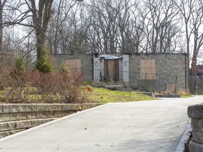 Little remains of a house at 203 Commissioners Rd. E. in London that was destroyed by fire nearly a year ago. The owner is suing an insurance company for a payout on the home. (Derek Ruttan/The London Free Press)