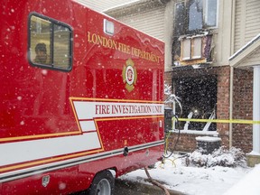 London police, firefighters and the Ontario fire marshal's office are investigating a fire Saturday morning at a townhouse unit on Purser Street in northeast London that injured two children and an adult. Derek Ruttan/The London Free Press/Postmedia Network