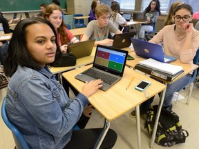 Tsion Samison, Rhen Boyle, Cole Hill and Noor Elsadi use Chromebooks in their Grade 9 French class at Central secondary school in April 2017. About 8,000 Chromebooks were distributed to Grade 9 students over four years at a cost of almost $3 million.
(Free Press file photo)