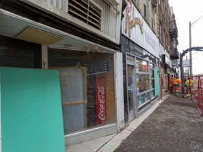 Empty buildings on Richmond south of Dundas where construction has forced sidewalk and road closures in London, Ont. (Mike Hensen/The London Free Press)