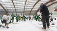 Head coach Rob Crowther explains a drill during a London Jr. Knights under-16 team practice Thursday.