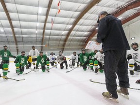 Head coach Rob Crowther explains a drill during a London Jr. Knights under-16 team practice Thursday.