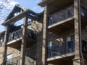 A balcony fire in a 32-unit apartment building in Strathroy has possibly damaged the entire roof of the structure forcing all the tenants to be moved to other locations. (Mike Hensen/The London Free Press)