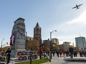 A Royal Canadian Airforce C130J Hercules flyover occurred at the start of Remembrance Day ceremonies in downtown London, the hometown of pilot Derek Pasma. Photograph taken on Wednesday November 11, 2020. Mike Hensen/The London Free Press/Postmedia Network