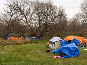 An estimated 130 to 200 Londoners are sleeping outdoors, many of them in tents along the south branch of the Thames River in an area known as the Wellington Valley Park. (Mike Hensen/The London Free Press)