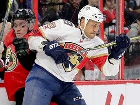 Michael Haley checks Mark Borowiecki into the boards the Ottawa Senators played the Florida Panthers in 2018.