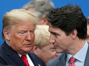 President Donald Trump talks with Prime Minister Justin Trudeau during a North Atlantic Treaty Organization Plenary Session at the NATO summit in Watford, Britain, December 4, 2019.