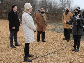 Kimberly Wood, development manager with London's Housing Development Corporation (right), explained on Wednesday to London MPs Peter Fragistkatos (left) and Kate Young and Mayor Ed Holder and Coun. Stephen Turner plans for a modular building slated to be built at 122 Base Line Rd. JONATHAN JUHA/The London Free Press