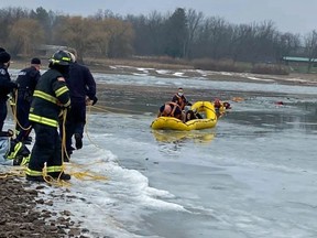 Woodstock firefighters rescue two boys after they fell through the ice Sunday morning on the reservoir at Pittock Conservation Area. Handout