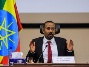 Ethiopian Prime Minister Abiy Ahmed gestures at the House of Peoples Representatives in Addis Ababa, Ethiopia, on November 30, 2020 to respond to the Parliament on the current conflict between Ethiopian National Defence Forces and the leaders of the Tigray Peoples Liberation Front (TPLF). - Ethiopian Prime Minister Abiy Ahmed said on November 30, 2020 Tigray region's dissident leaders had fled west of the regional capital after weeks of fighting, but said federal forces were monitoring them closely and would "attack" them soon.

Abiy, winner of last year's Nobel Peace Prize, this month ordered military operations against leaders of Tigray's ruling party, the Tigray People's Liberation Front (TPLF), in response to what he said were TPLF-organised attacks on Ethiopian federal army camps. (Photo by AMANUEL SILESHI/AFP via Getty Images)
