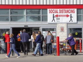 Shoppers enter and exit Costco on Wellington Road in London on Thursday December 10, 2020. (Derek Ruttan/The London Free Press)