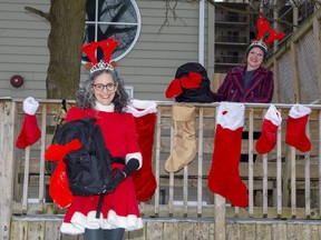 The Unity Project's development director Silvia Langer (left) and executive director Chuck Lazenby with "Santa sacks" full of practical and fun items for the needy in London. Anyone wanting to contribute to the initiative can participate at www.upsantasacks.ca . (Derek Ruttan/The London Free Press)