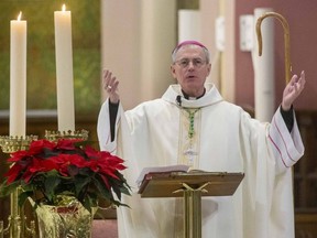 Bishop Ronald Fabbro speaks at a Christmas mass to about 50 parishioners at St. Peter's Catholic Basilica in London, Ont. on Friday Dec. 25, 2020. Derek Ruttan/The London Free Press/Postmedia Network