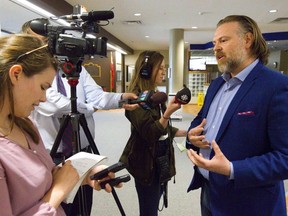 Schoolboard trustee Jake Skinner talks to the media before a TVDSB budget meeting at the education centre in London, on Tuesday June 11, 2019. (Mike Hensen/The London Free Press)