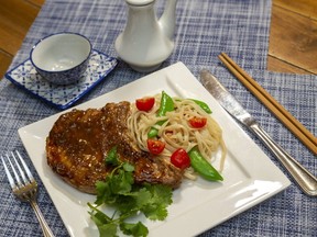 Soy sauce, ginger, garlic and chili paste add a burst of flavour to these quick and easy to prepare  Asian pork chops, food columnist Jill Wilcox says. (Mike Hensen/The London Free Press)