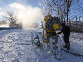Shaun Bonnallie, the outside operations manager at Boler Mountain, checks on one of their six fan guns which was making snow on the bunny hill earlier this month. Due to pandemic restrictions, Boler is closed despite thousands spent on snow-making. (Mike Hensen/The London Free Press)