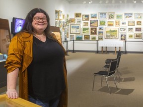 Dana Lumby, technician assistant at the Huron County Museum in Goderich, shows part of the exhibit celebrating the works of the late Benmiller artist Jack McLaren, who had a great influence on the Canadian arts scene.
(Mike Hensen/The London Free Press)