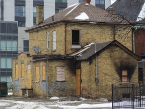 A house at 689 King St. shows damage from a Nov. 22 fire. LifeSpin’s executive director Jacquie Thompson warned city hall in August and again in October that it needed to take steps to prevent a fire in the building because people were going in and out of it even though city hall had ordered that no one could live there because it was unsafe. Photograph taken on Wednesday December 30, 2020. (Mike Hensen/The London Free Press)