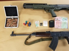 Four Londoners face charges after police seized two guns, ammunition, drugs and other items from a Conway Avenue home on Sunday. (London police supplied photo)