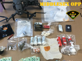 Two London men are charged after police arrested two suspects in possession of a drone, drugs and cash near the Elgin-Middlesex Detention Centre. (OPP supplied photo)