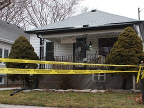 Yellow police tape is shown Sunday around a house on Essex Street in Sarnia. Sarnia police are investigating the death of 66-year-old Sue Elin Lumsden, who lived there alone.