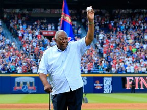 FILE - JANUARY 22, 2021: It was reported that legendary Atlanta Brave and Major League Baseball record holder Hank Aaron died Friday at the age of 86 January 22, 2021. ATLANTA, GA - OCTOBER 02: Hall of Famer Hank Aaron throws out the ceremonial last pitch at Turner Field to Bobby Cox after the game between the Atlanta Braves and the Detroit Tigers at Turner Field on October 2, 2016 in Atlanta, Georgia. (Photo by Daniel Shirey/Getty Images)