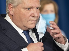 Ontario Premier Doug Ford prepares to speak at Queen’s Park in Toronto on Tuesday January 12, 2021 to announce a state of emergency and stay at home order for the province of Ontario. (THE CANADIAN PRESS/Frank Gunn)