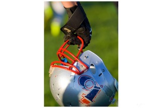 A London Beefeaters player carries his football helmet. (File photo)