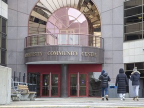 Students traverse an otherwise empty patio in front of  Western University's community centre  in London, Ont. on Wednesday, Jan. 20, 2021. The student union joined a faculty group in condemning an international holiday vacation by Western's chancellor. (Derek Ruttan/The London Free Press)