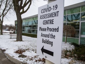 A sign directs visitors to the COVID-19 assessment centre at Carling Heights Optimist Community Centre. Middlesex-London Health Unit reported three deaths and 52 new COVID-19 cases Friday.(Derek Ruttan/The London Free Press)