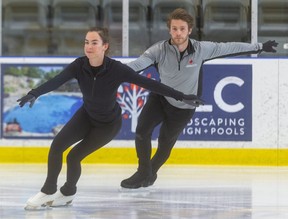 London's Evelyn Walsh and Belleville's Trennt Michaud skate at the Komoka Wellness and Recreation Center in this file photo. (Mike Hensen/The London Free Press)