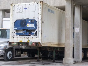 A refrigerated trailer is parked at the rear of University Hospital. (Mike Hensen/The London Free Press)