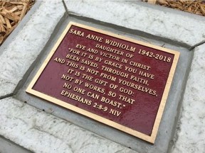 A close-up of the plaque at the memorial area on the Ganatchio Trail in Windsor dedicated to Sara Anne Widholm, who died at the age of 76 in 2018 following a brutal beating on Oct. 8, 2017.
