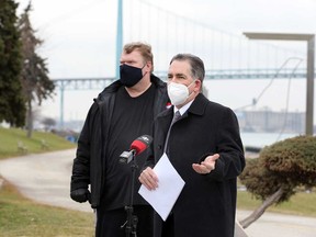Windsor West MP Brian Masse and Customs and Immigration Union Local 18 president Ken Turner speak with media on the Windsor riverfront on Wednesday, asking for rapid COVID-19 tests to be made available at the border.