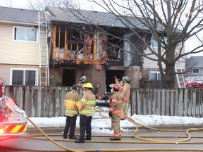 London firefighters responded Saturday morning to house fire in east London that caused heavy damage to a townhouse on Admiral Drive. Photo taken on Feb. 27, 2021. JONATHAN JUHA/The London Free Press