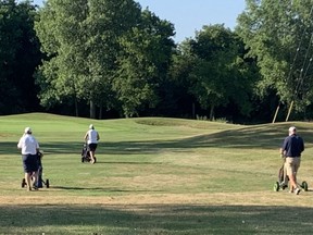 A foursome hit the links on July 18, 2020, to protest the closing of the city-owned River Road Golf Course. (NORMAN DE BONO, The London Free Press)